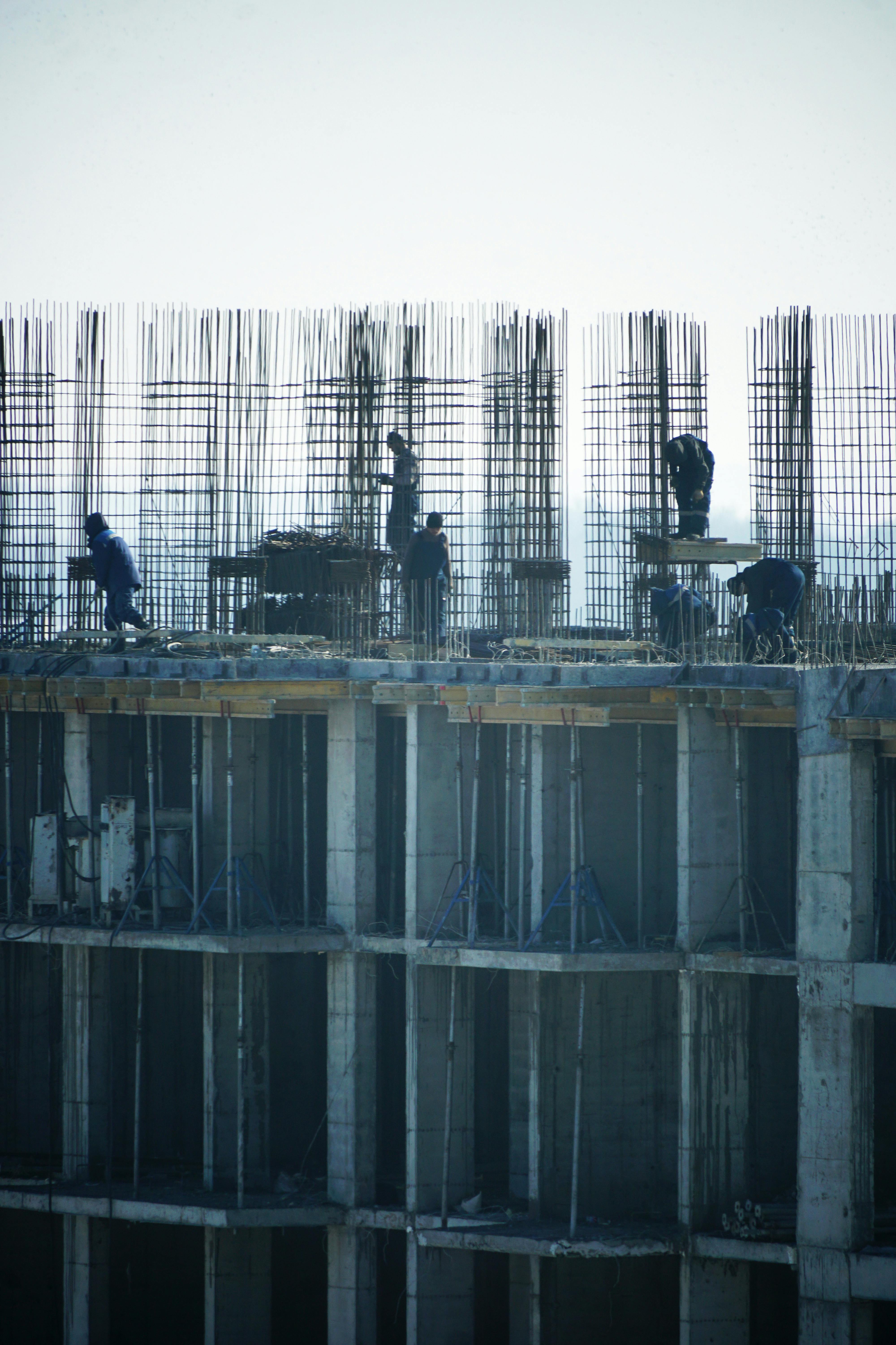 Construction management team reviewing blueprints